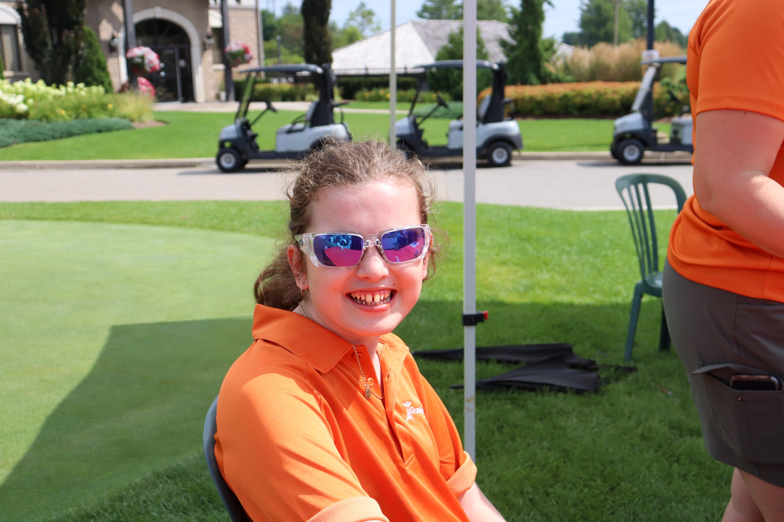 Girl smiling at the 27th Annual Golf for Grandview Kids Charity Golf Classic